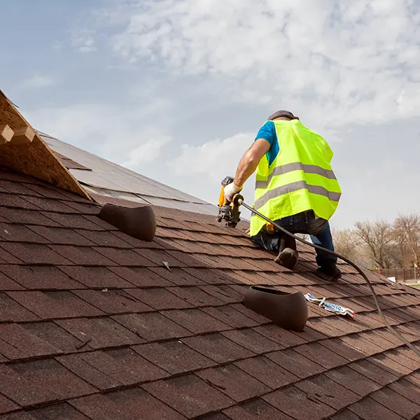 Man fixing a roof