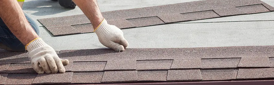 Roofer repairing roof